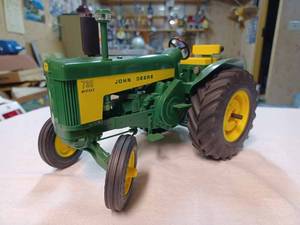 lot 38 image: John Deere 730 Standard Diesel Plastic Tractor 116th Scale - No Box