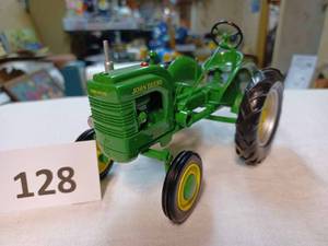 lot 128 image: Spec Cast John Deere 116th Scale - No Box, LA Written in Marker on Battery Box