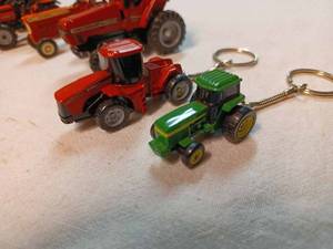 lot 163 image: Four Ertl 164th Scale Tractors, 2 - Tractor Ley Chains and John Deere Shop Tools