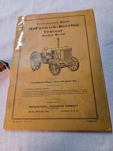 lot 177 image: 1935 Instruction Book McCormick-Deering Tractor Model W-30 and a Small McCormick Farmall Cardboard Sign