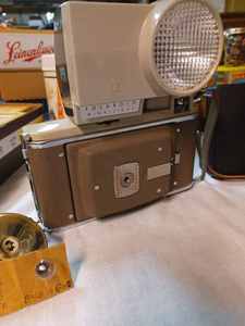 lot 189 image: Vintage Polaroid Land Camera with Wink-Light Flash Attachment and a Polaroid 450 Camera