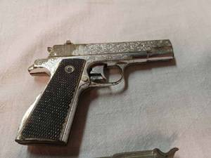 lot 195 image: Ten Vintage Cap Guns and 8-Cards of New Caps Spitfire, Nichols Brave, S.D.S., Luger, Nichols Paint and More