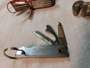 lot 202 image: Two Pocket Knives and a 6-inch Pipe Wrench