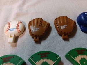 lot 203 image: Nine Plastic Cracker Jack Whistles