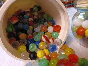 lot 208 image: Small Glass Jar of Marbles and a Plastic Canister about 23 Full of Assorted Marbles