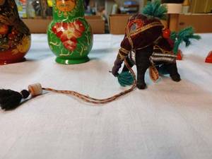 lot 228 image: Two 10-Piece Wooden Dolls, an 8-Piece Wooden Doll, and an Elephant Made in India, and 2-German Nut Crackers