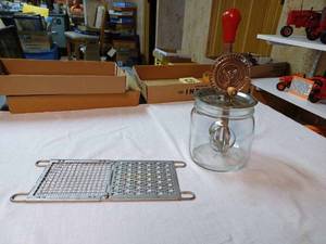 lot 229 image: Vintage Merry Whirl Egg Beater with Wood Handle, a Square Jar the Beater fits on but may not match and Grater
