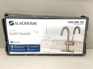 lot 83 image: Glacier Bay Dorind Single Hole Single-Handle High-Arc Bathroom Faucet in Brushed Nickel. 