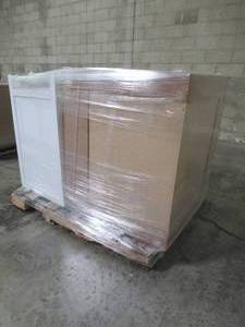 UNTOUCHED WHOLESALE PALLET CONTAINING VANITY CABINET AND KITCHEN CORNER CABINET