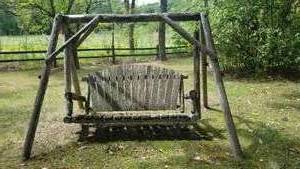 lot 98 image: Vintage Log Loveseat Swing and Frame (as)