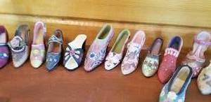 lot 91 image: Collection of 17 Tiny Shoes, A