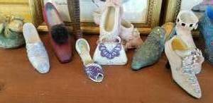 lot 90 image: Collection of Tiny Shoes and 2 Framed Show Prints