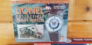 lot 411 image: Lionel Train Wall Clocks (2) plus Collectible Train Wrist Watch