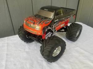 lot 242 image: HPI Racing Wheely King 4x4 RCR Truck, Red
