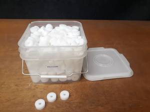 lot 400 image: Bucket full of Nylon Bushings - Dimensions are 1-38 OD x 38 ID x 916 Tall