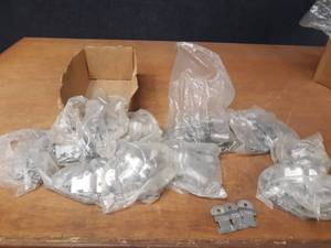 lot 401 image: Large Lot of Stainless Steel Unistrut Conduit Clamps - 12 up to 1