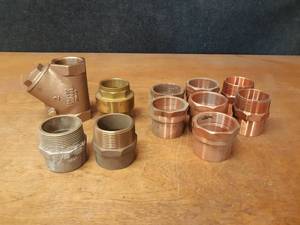 lot 341 image: Lot of (11) 2 and 2-12 Copper  Brass Connectors and Check Valves