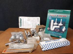 lot 510 image: Large Lot of Plumbing Supplies - Under-Lav Cover, Drain Tubes Supply Lines, Cleanout Cover Bolts and More