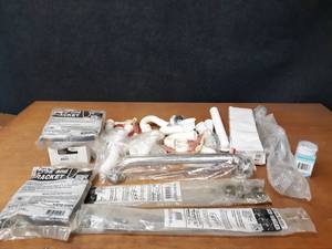lot 516 image: Lot of PVC Drain Tubes, Mop Hanger Brackets, Hose Brackets and More