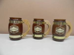 lot 63 image: SET OF 3 VINTAGE GRAIN BELT BEER AMBER GLASS WOOD HANDLE SIESTA WARE STEINS - NICE - SEE PICTURES