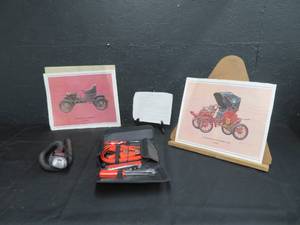 lot 87 image: EMERGENCY CAR KIT, SNAKE LIGHT, AND 2 OLD CAR PRINTS FROM 1905-1906
