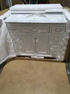 HOME DECORATORS WINDLOWE 41 IN. W X 22 IN D X 35 IN. H Bath Vanity in White With Carrera Marble Vanity Top with White Sink Customer Returns See Picures