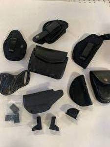 lot 76 image: Variety of Pistol Holsters & Speed Loaders