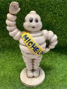 lot 85 image: Michelin Man Cast Iron Piggy Bank 6 Tall