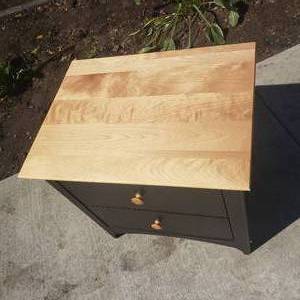 lot 76 image: Sleek Black Nightstand