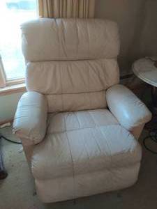 Cream colored rocking leather recliner