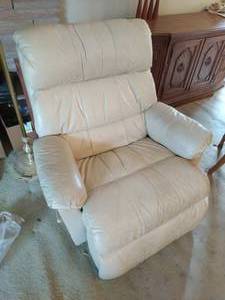 Cream colored rocking leather recliner by Barcalounger