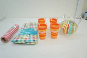 Pitcher, glasses, table cloth and fabric