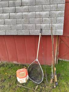lot 23 image: 4 Fishing Poles, two have reels, La...