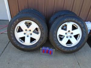 Qty of 4 2014 - 2016 JK series Jeep wheels & tires. Wheels are in good condition. P25570r18. As shown.