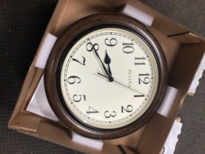 lot 27 image: Bulova 16 in. H x 16 in. W Wall Clock with Solid Oak Case