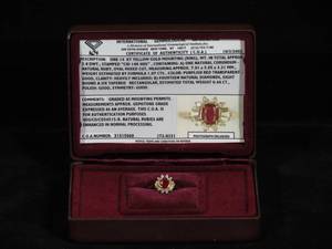 lot 7 image: 14 Karat Yellow Gold Ladies Ruby and Diamond Ring - IGI Certified