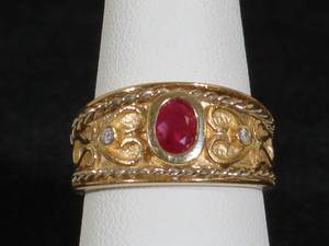 lot 8 image: 14 Karat Yellow Gold Ladies Wide Band Ruby and Diamond Ring
