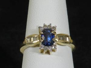 lot 12 image: 14 Karat Yellow Gold Ladies Sapphire and Diamond Ring