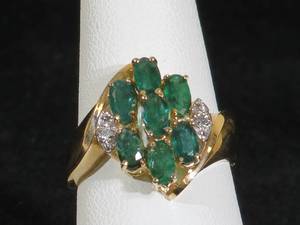 lot 20 image: 14 Karat Yellow Gold Ladies Emerald and Diamond Cluster Ring
