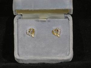 lot 36 image: Pair of 10 Karat Yellow Gold Diamond Heart Stud Earrings