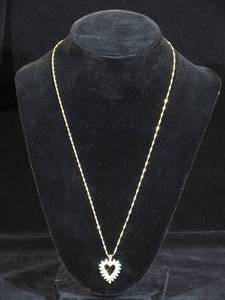 lot 34 image: 14 Karat Yellow Gold Diamond Heart Pendant with Chain