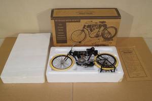 lot 74 image: Limited Edition 1903-04 Harley Davidson 16 Scale Die Cast Motorcycle