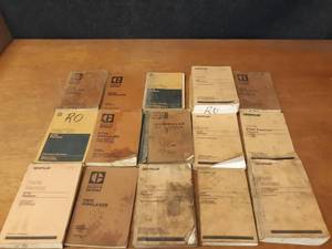 lot 33 image: Lot of (15) CATERPILLAR Parts Manuals - 583K Pipelayer, 571G, 572G Pipelayer, 561C Pipelayer, 14G Motor Grader - SHIPPING AVAILABLE