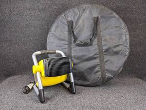 lot 142 image: Stanley Ceramic Air Heater - Model 675900 and Large Round Carrying Case - Case measures 27 diameter x 6 deep - NO SHIPPING