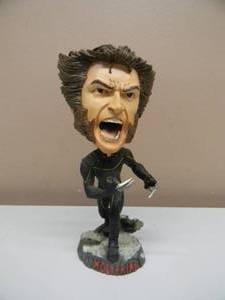 lot 23 image: RARE NECA WOLVERINE BOBBLEHEAD - APPROX 8 - SEE PICTURES