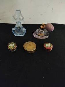 Two Perfume Bottles and Three Storage Containers
