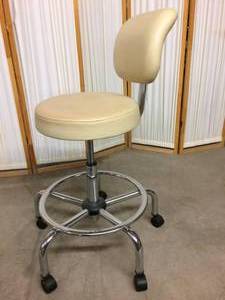 lot 27 image: Office Master CL35 Chair (Sand) Exam Room Adjustable Height Stool With Foot Rest Ring - Good Condition With Seat Has Discoloration & Minor Wear To Back Rest