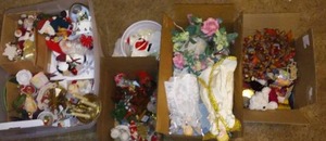 lot 58 image: Huge Christmas lot, angel toppers, Santas, candle holders and more.