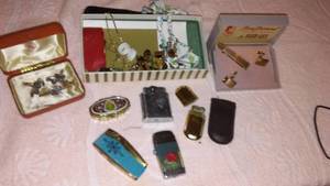 lot 61 image: Cigar lighters, Anson cufflink sets, and jewelry.