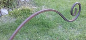 lot 106 image: (3) Wrought iron deck railing hanging plant supports.